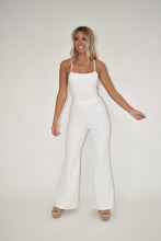 Load image into Gallery viewer, online clothing boutique, white flare leg jumpsuit, denim jumpsuit
